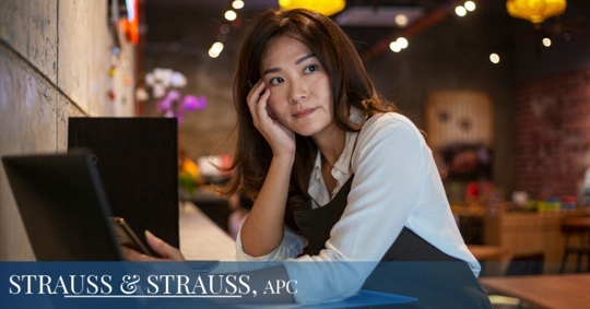 Asian woman working with hand on face